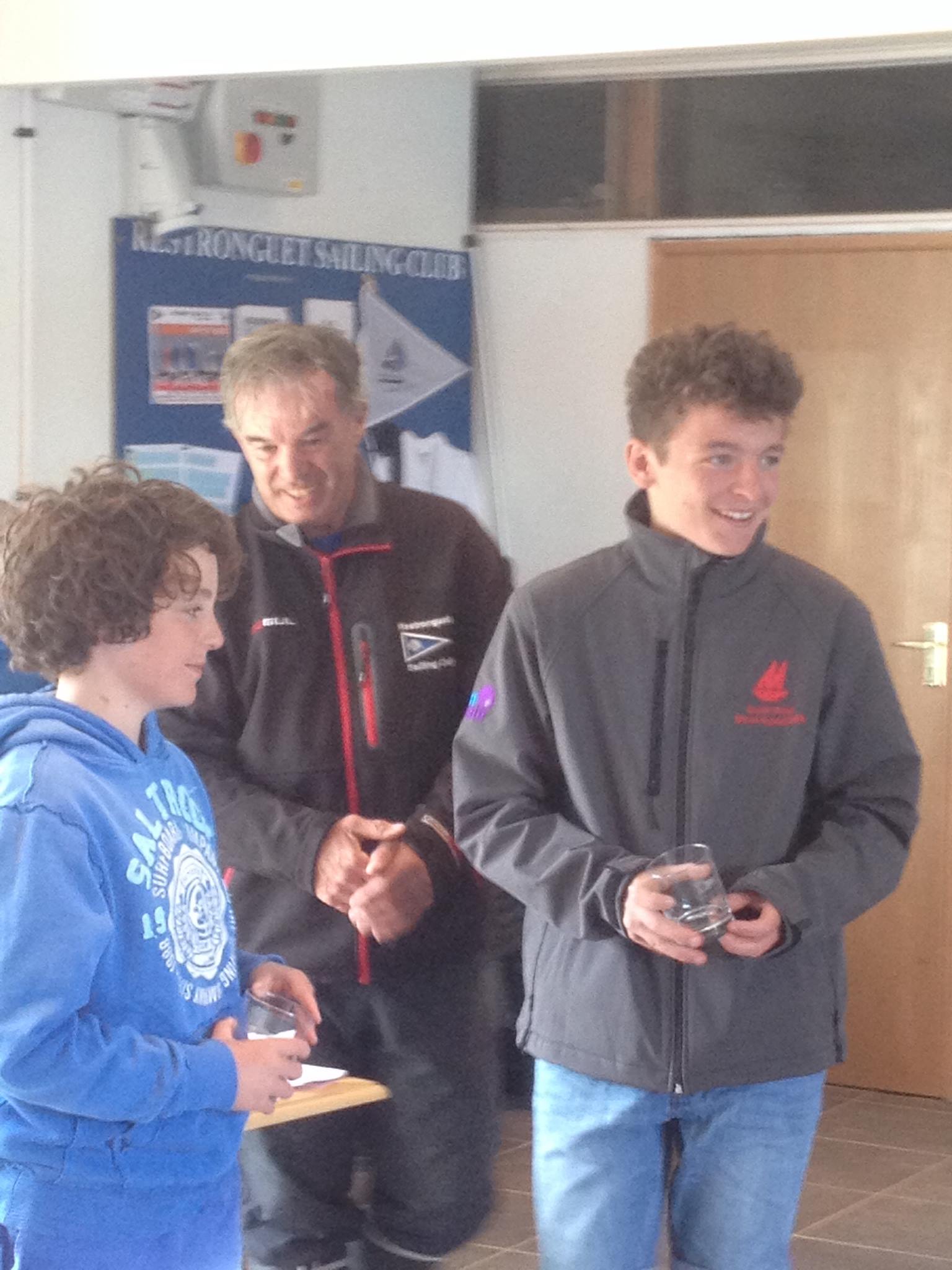 Two boys collecting their prizes from RSC Sailing Secretary
