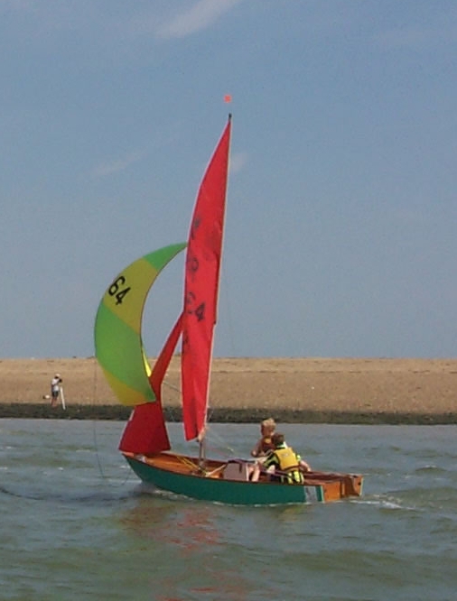Two boys sailing a wooden Mirror at Brightlingsea