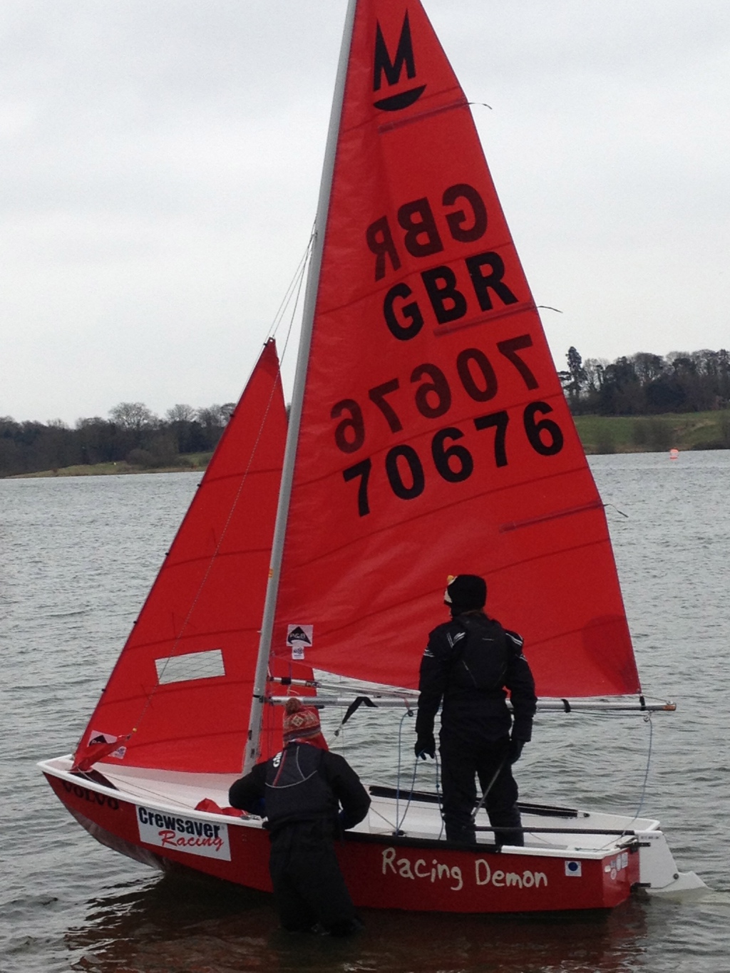 A red GRP Mirror dinghy called 