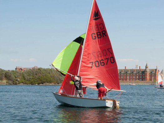 Mirror dinghy 70670 sailing in a light breeze with the spinnaker up