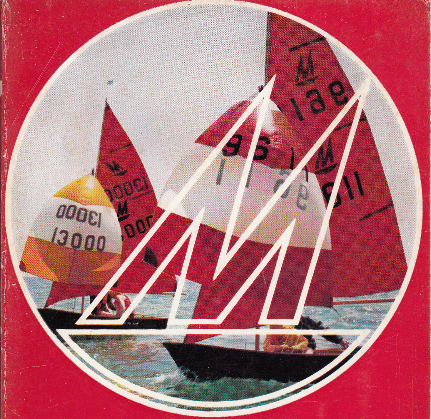 Two black Mirror dinghies racing with spinnakers set on the sea on a sunny day