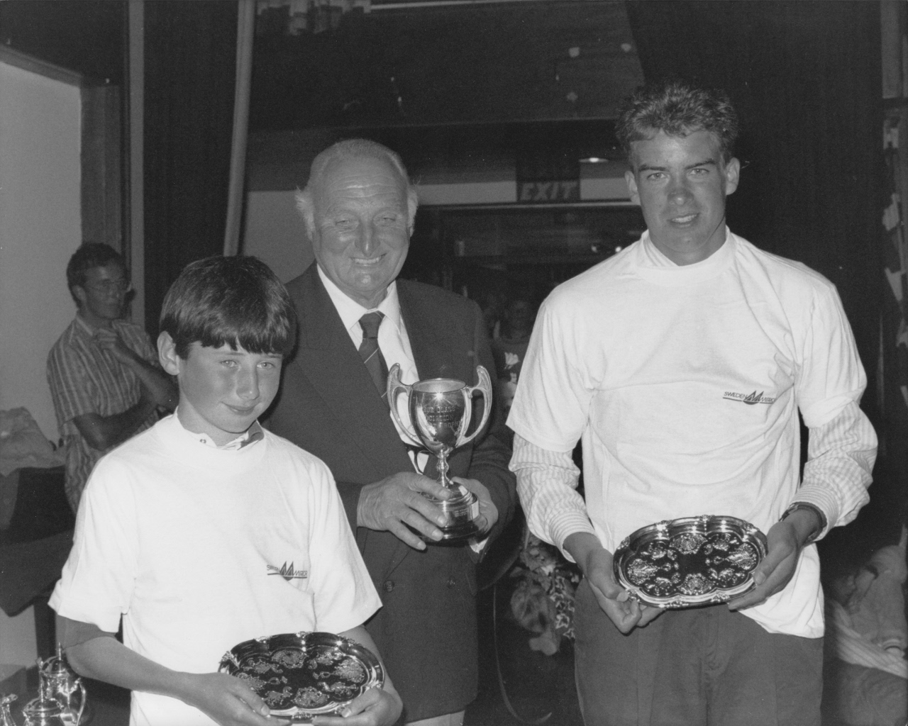 Open Championship winners, Dan O'Grady (right) & Ciaran Scott from Sutton Dinghy Club in Ireland. The man holding the trophy is Paddy O'Neill, President of the Irish Sailing Association - photo by Arthur Sidey An older teenager and his young crew receiving their prizes and facing the camera