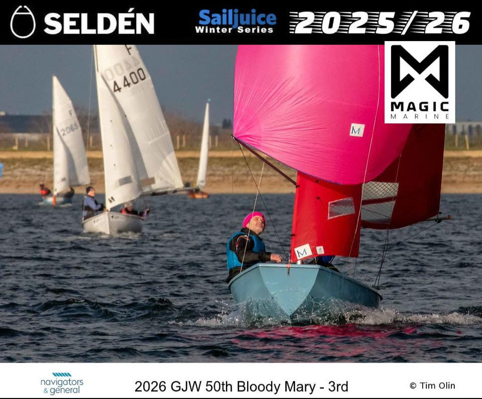 A blue Mirror with pink spinnaker leading two Firefly dinghies on a run.