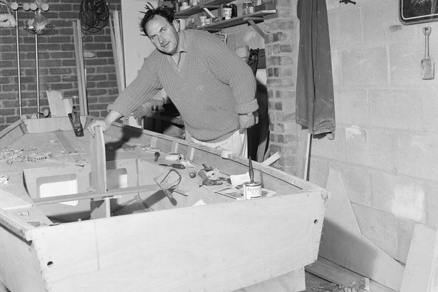 Mr Cooper now builds his Mirror Dinghy in the garage of his Hastings home 1969