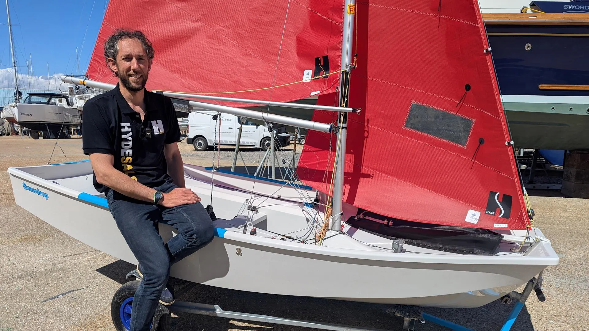 Ben McGrane perched on the gunwale of his fully rigged Mirror dinghy