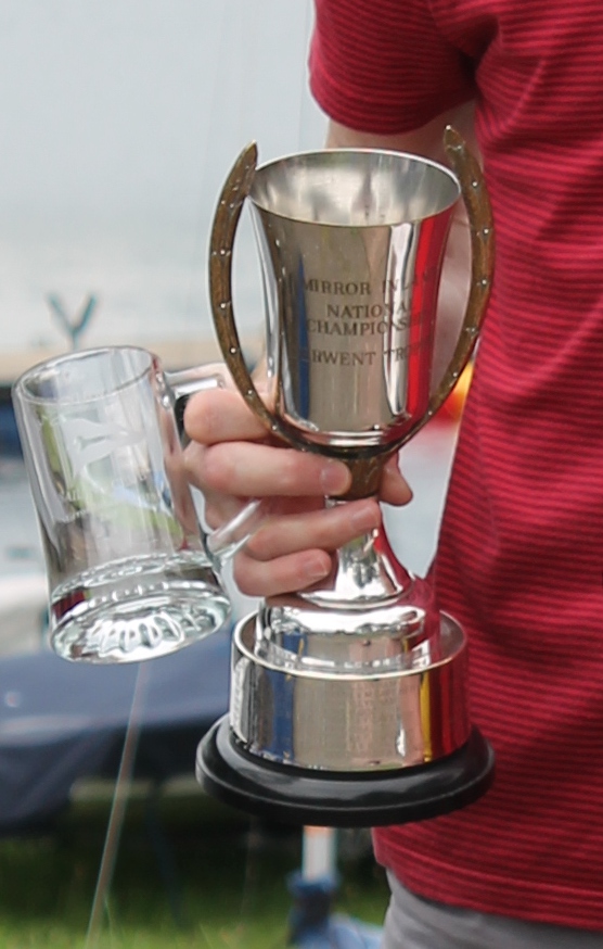 A silver cup with handles which extend above the rim